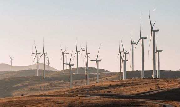 Wind turbines across a dry, open landscape.